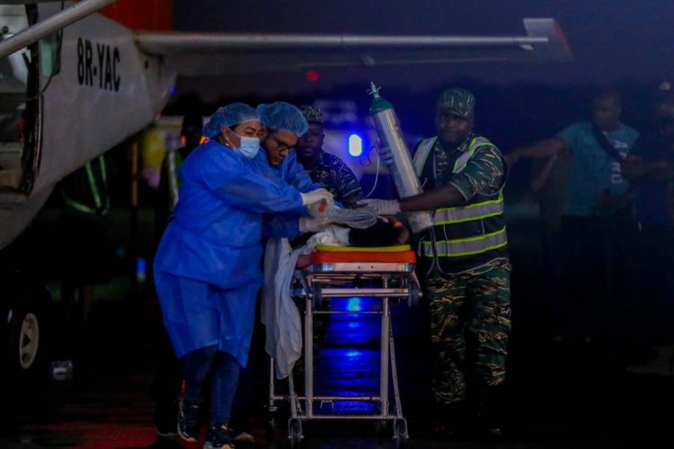 Ministry of Health medical staff at the Ogle airport early Monday morning. (Ministry of Health photo)