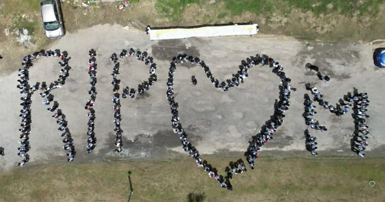 A sympathy display by North Ruimveldt students over the deaths of the 19 children.  (Ministry of Education photo)