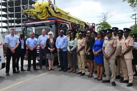 Officials in front of one of the pieces of equipment (Ministry of Home Affairs photo)