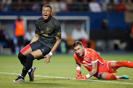 1/2] Soccer Football - Ligue 1 - Troyes v Paris St. Germain - Stade de l’Aube, Troyes, France - May 7, 2023 Paris St Germain’s Kylian Mbappe reacts after a challenge from Troyes’ Gauthier Gallon REUTERS/Johanna Geron