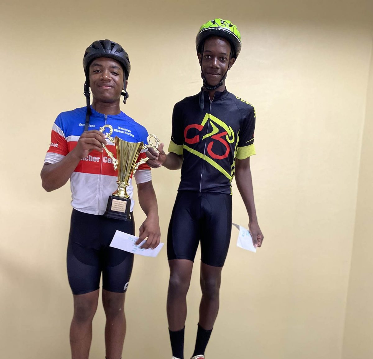 Sidwell Sandy, right,  who finished atop the podium in the juvenile category at the recently concluded Independence Three-Stage road race.
