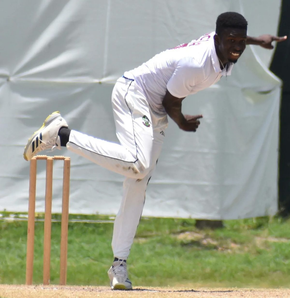 Team Weekes off-spinner Kevin Sinclair sends down another delivery during his destructive spell against Team Headley in the Headley-Weekes Tri-Series yesterday at the Coolidge Cricket Ground in Antigua. (CWI Media photo)