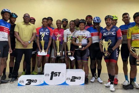 The prize winners of the 40th edition of the NSC Independence Three-Stage road race pose for a photo with Director of Sport, Steve Ninvalle upon completion of the event yesterday. (Emmerson Campbell photo)