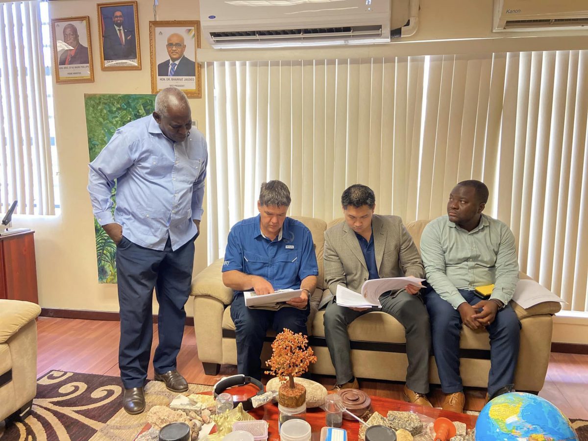 Minister Robeson Benn (left) and others meeting with the ATF representative. (Ministry of Home Affairs photo)