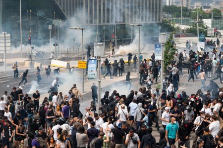 Demonstrators clash with police following a march protesting the shooting of Nahel, 17, by a police officer in the Nanterre suburb of Paris.Credit: Bloomberg