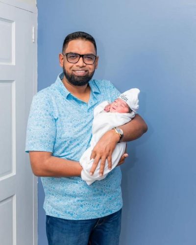 President Irfaan Ali with his son (Office of the President photo) 