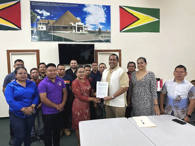 Iwokrama’s CEO, Dane Gobin (third from right) and Vice Chairwoman of the NTC, Sonia Latchman after the signing of the MOU. Looking on (2nd from right) is Dr Raquel Thomas, Director of Resource Management and Training at Iwokrama together with Executive Members and administrative staff from the NTC.  (Iwokrama photo)