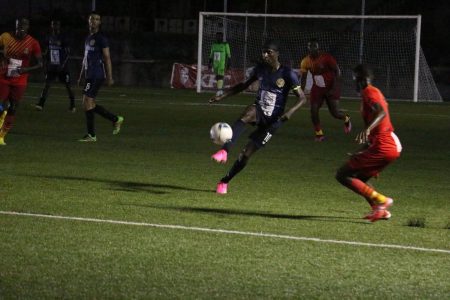 Andrew Murray Jr of Western Tigers trying to control the ball against GDF in the KFC Elite League
