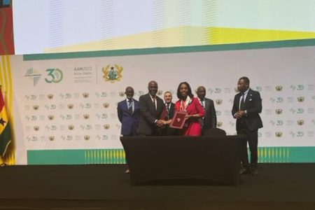 New Hayven Merchant Bank CEO, Floyd Haynes, shaking hands with a representative of the Afreximbank at the signing of the agreement 