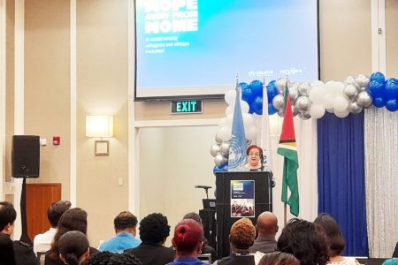 Minister of Parliamentary Affairs and Governance Gail Teixeira speaking at the UNHCR event