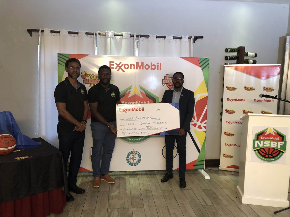 Chris Bowman (centre), Co-Director of the YBG Organization, receiving the sponsorship cheque from Ryan Hoppie, ExxonMobil Community Relations Advisor (right). Also in the photo is YBG Co-Director Rayad Boyce
