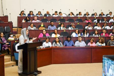 Her Excellency Reem Al Hashimy, Minister of State for International Cooperation of the United Arab Emirates, yesterday addressed a number of persons, including students from various secondary schools, at the Arthur Chung Conference Centre, Liliendaal. According to the Department of Public Prosecution (DPI) the minister she expressed her profound pride in standing amidst the future generation of Guyana, and underscored the importance of having the youths lead the way. She encouraged young people to use education as a superpower, a transformative tool that, despite its weight, must be embraced as an essential lifelong journey.  She is seen in the photograph addressing a section of those in attendance. (DPI photo)