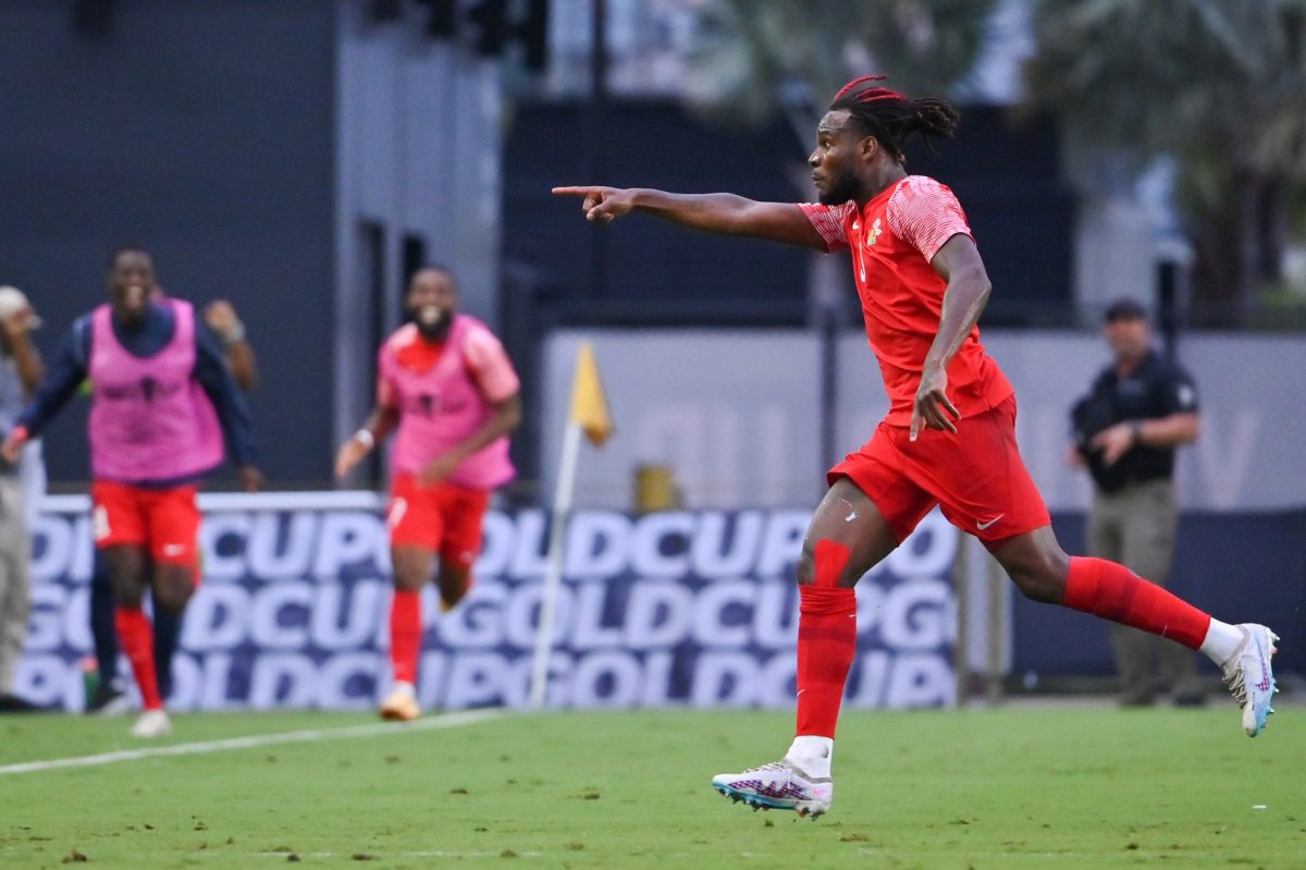 Guadaloupe’s Andreaw Gravillon races to celebrate after scoring from a free kick. (Photo courtesy Concacaf website)
