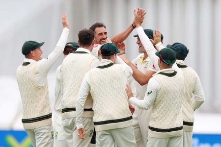 The Australia cricketers celebrate the fall of another England batsmen’s wicket