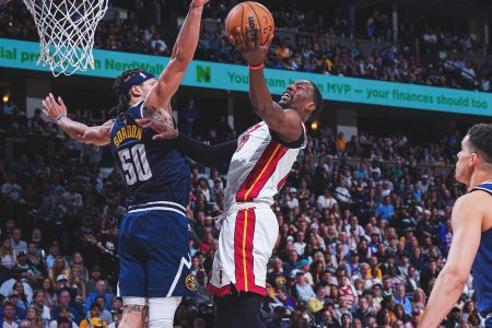 Denver Nuggets’ Aaron Gordon attempts to block a left-handed layup by Miami Heat’s Bam Adebayo Sunday night. (Twitter photo)