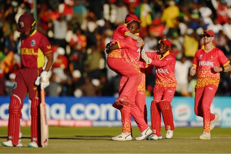 The Zimbabwe players celebrate the fall of Shai Hope’s wicket. (Photo courtesy Twitter)