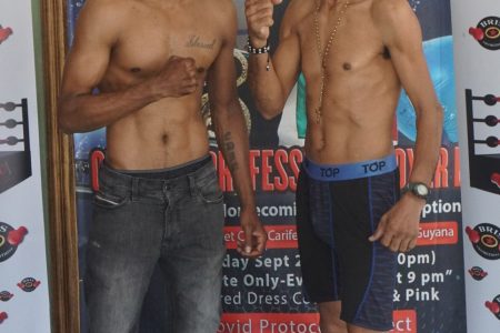 Ronald Ramos (right) tipped the scales at a shredded 117.5 pounds, while the equally supremely conditioned Elton Dharry was right on the bantamweight limit at a fighting ready 118 pounds at yesterday’s weigh in. (Emmerson Campbell photo)
