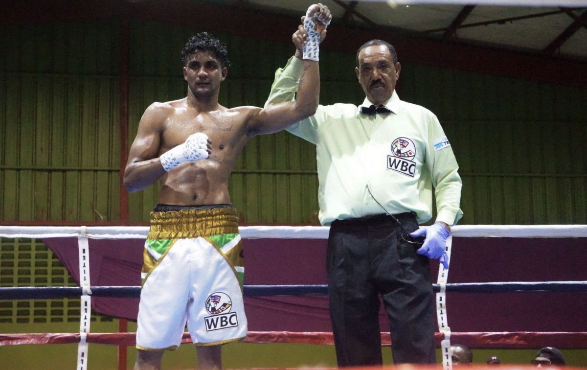 Referee, Eon Jardine raised the hand of Elton Dharry following his unanimous decision win over Colombian journeyman, Ronald Ramos on Saturday night.