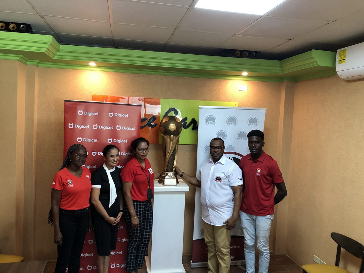 Digicel’s Chief Commercial Officer Simone Pierre (2nd from left), Digicel Communications Manager Vidya Sanichara (3rd from left), and Petra Organization Co-Director Troy Mendonca (2nd from right) displaying the tournament’s lien trophy. Also in the photo are tournament coordinator Lavern Fraser-Thomas (left) and Petra Organization member Mark Alleyne (right)