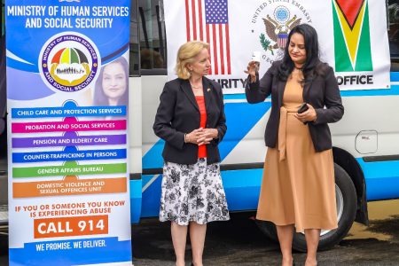 Minister of Human Services and Social Security,  Dr. Vindhya Persaud (right) with the keys to the 17-seat bus. Also in this photo is the US Ambassador to Guyana Sarah-Ann Lynch
