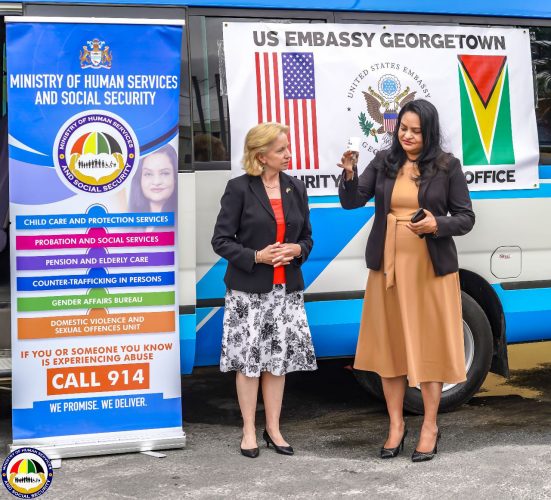 Minister of Human Services and Social Security,  Dr. Vindhya Persaud (right) with the keys to the 17-seat bus. Also in this photo is the US Ambassador to Guyana Sarah-Ann Lynch