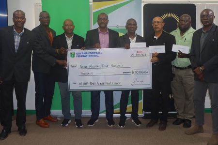 GFF President Wayne Forde (centre) surrounded by several presidents and representatives of the regional member associations, posing with the MFAP sponsorship cheque that will aid in the start of the respective league tournaments.