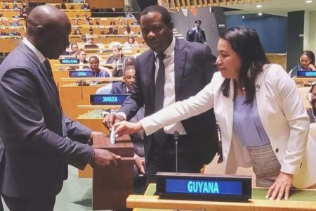 Guyana’s Permanent Representative to the United Nations, Carolyn Rodrigues-Birkett  voting at the elections.  Also in photo is Minister of Foreign Affairs, Hugh Todd. (Ministry of Foreign Affairs photo)