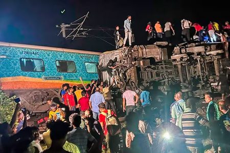 Rescuers work at the site of passenger trains that derailed in Balasore district, in the eastern Indian state of Orissa, Friday, June 2.   © AP 