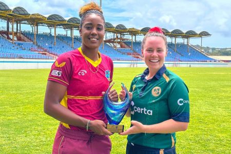 West Indies women’s team skipper Hayley Matthews and  her counterpart Ireland’s Laura Delany pose with the series trophy.