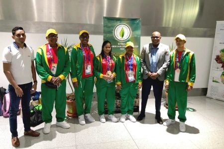Director of Sport Steve Ninvalle (2nd from right) posing with the Guyana Special Olympics World Games contingent following their return on Tuesday morning at the Cheddi Bharrat Jagan Airport, Timehri.
