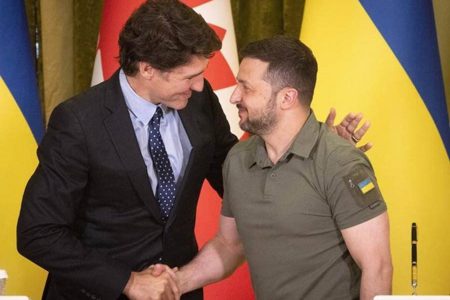 Next to Canada's Justin Trudeau, a smiling President Volodymyr Zelenskiy sounded optimistic. (AP PHOTO)

