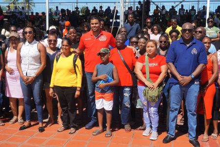 Minister of Culture, Youth, and Sport Charles Ramson Jr, and Director of Sport Steve Ninvalle posing with the respective participants following the official launch of the inaugural adult ‘Learn to Swim’ programme at the National Aquatic Centre, Liliendaal yesterday.