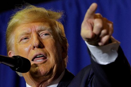 FILE PHOTO: Former U.S. President and Republican presidential candidate Donald Trump attends a campaign event in Manchester, New Hampshire, U.S., April 27, 2023. REUTERS/Brian Snyder