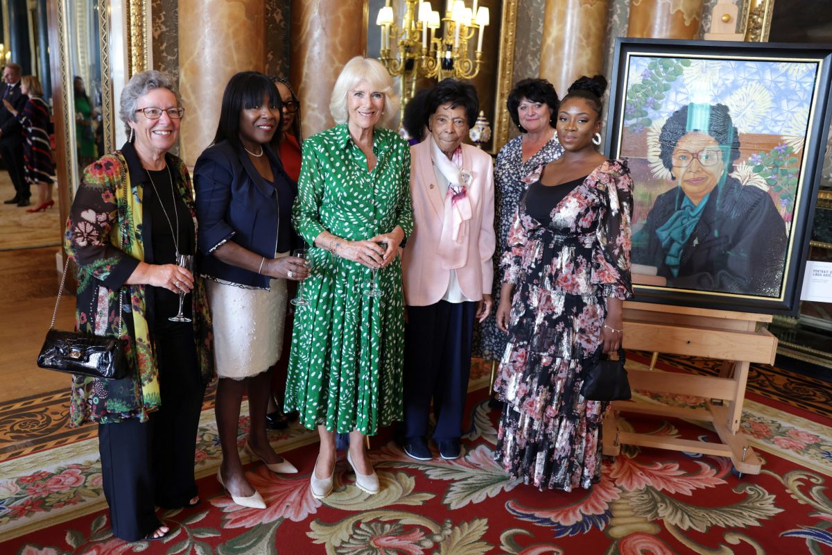 Britain's Queen Camilla  (third from left) poses with Linda Haye and her family with during a reception to mark the 75th anniversary of the arrival of HMT Empire Windrush to British shores, at Buckingham Palace on June 14, 2023 in London, Britain. During the reception to celebrate the Windrush Generation, ten portraits of Windrush elders were unveiled. Chris Jackson/Pool via REUTERS