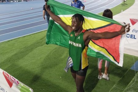 Emanuel Archibald basking in post-race glory after storming to victory in the finals of the blue riband men’s 100m final at the ongoing Central America and Caribbean (CAC) Games last night in El Salvador.  
