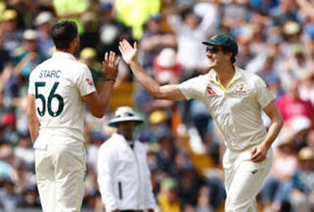 Australia’s Pat Cummins (right) celebrates with Mitchell Starc after taking a catch to dismiss England’s Harry Brook off his bowling Action Images via Reuters/Jason Cairnduff 