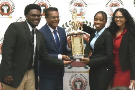 Winners of this year’s National Debating Competition pose with the Speaker of the National Assembly, Manzoor Nadir (2nd left) From left are Andrew King, Clarissa McClure and Saaya Prasad.
