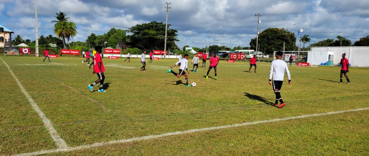 Action in the Waramuri (white) and Vryman’s Erven encounter in the round of 32 section of the Digicel Schools Football Championship
