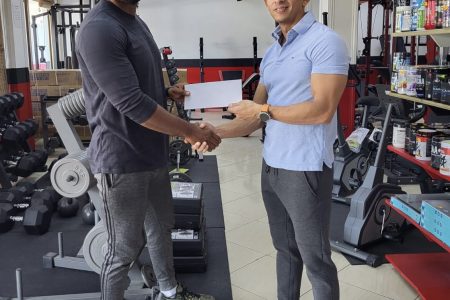 Yesterday, CEO of Fitness Express, Jamie McDonald (right) presented a sponsorship pact to organizer of SOC, Videsh Sookram. The event will be staged on Sunday at the Ramada Princess Hotel 