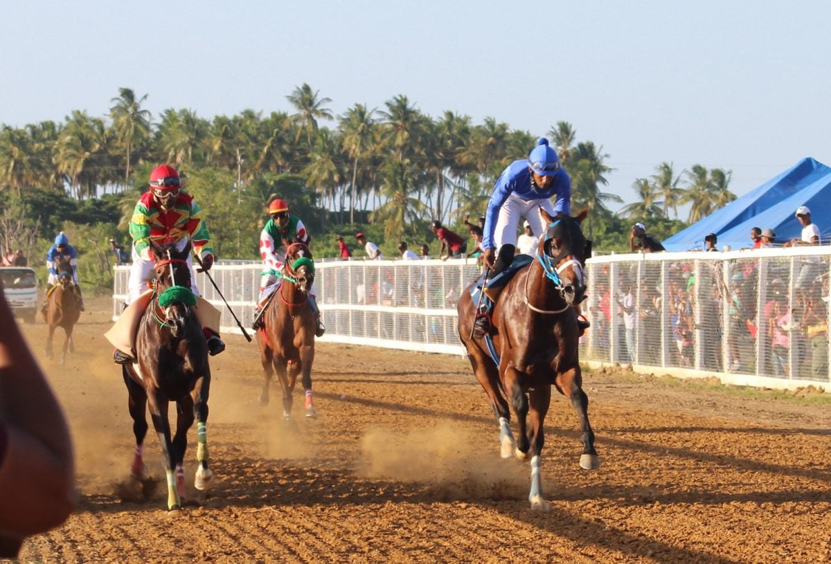 Alado, with champion jockey Colin Ross in the stirrups, won the feature one-mile event yesterday at the Port Mourant Turf Club.