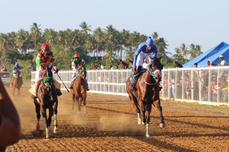 Alado, with champion jockey Colin Ross in the stirrups, won the feature one-mile event yesterday at the Port Mourant Turf Club.