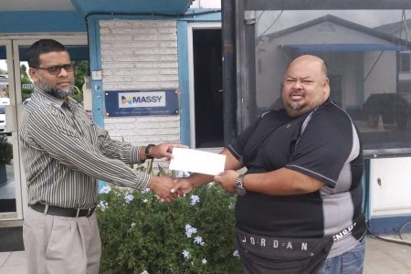 Massy Gas Products Vice president of Finance and Administration, Afzal Karim, (left) presented a sponsorship cheque to the union’s Treasurer, Troy Yhip yesterday.
