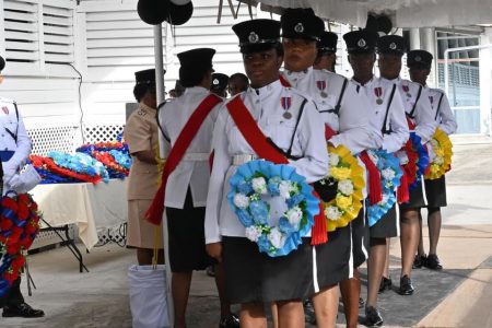 Members of the police force awaiting their turn to lay wreaths.