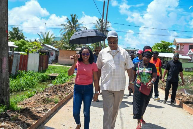 Minister of Public Works, Juan Edghill (second from left), during the walkabout in Sophia. (DPI photo)
