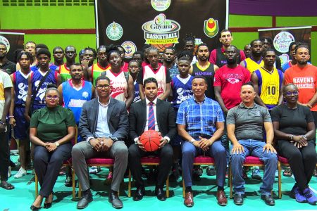Minister of MCY&S Charles Ramson Jr (centre) surrounded by
officials from the GBF and GABA as well as players from the representing clubs following the official launch of the ‘One Guyana’ Basketball League  