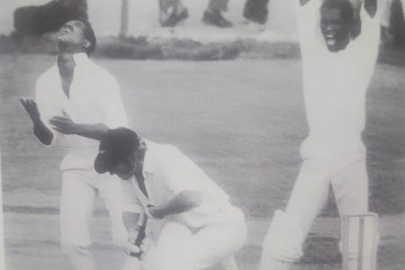 Mike Findlay (arms raised) screams his approval as Sobers calmly flips the ball in the air after catching Terry Jarvis off Inshan Ali in the Fifth Test versus New Zealand (1972) (Photo: 1972 West Indies Cricket Annual)