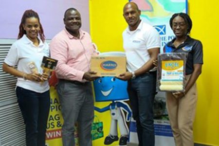 Retail Services Manager of Harris Paints Guyana Nigel Dodson (second, left) hands over the paints and supplies to FTTP’s Senior Manager of Gifts and Kind Jameel Davis. Flanking them are Logistics, Inventory and Human Resources Manager at FFTP Sidonia Peters (right) and Public Relations Manager at FFTP Jonelle DeVeira 