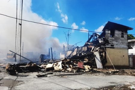 The smouldering ruins of the burnt-out building
