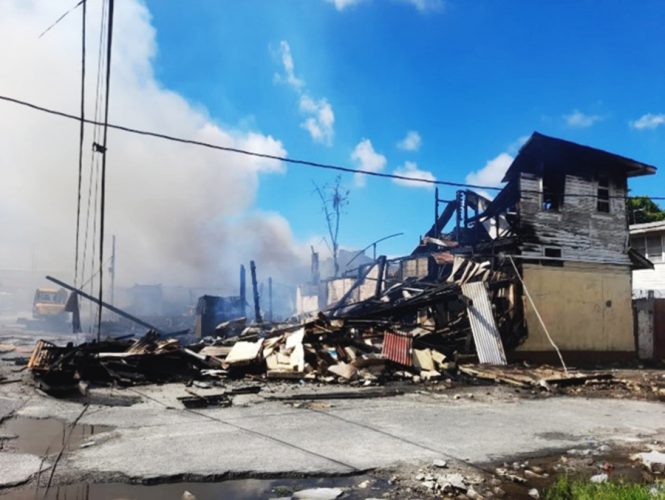 The smouldering ruins of the burnt-out building
