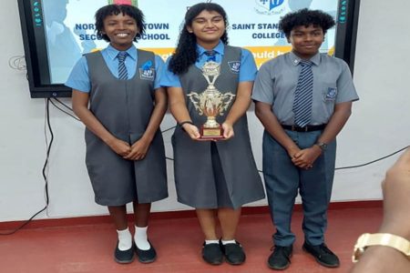 The winning St. Stanislaus College team (from L-R) Aziel Arthur, Italy Ton-Chung, and Reginald Brown